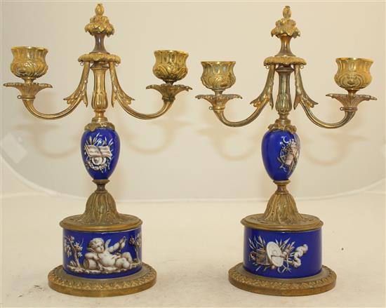 A pair of 19th century French ormolu mounted porcelain candelabra, 10in.